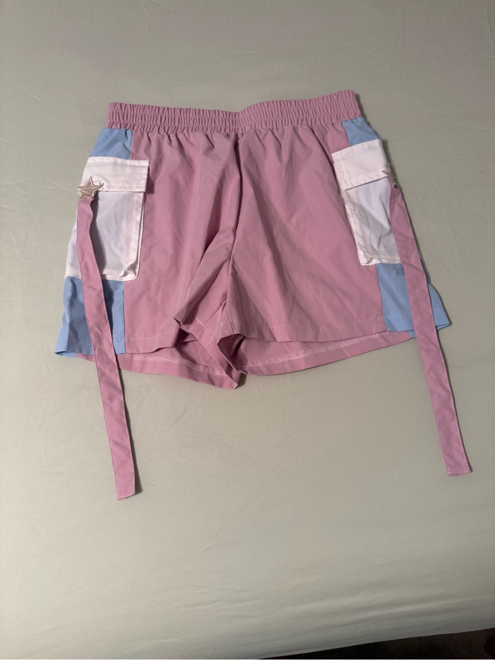 Pastel Pink Cargo-Style Women's Shorts with stars and tassels